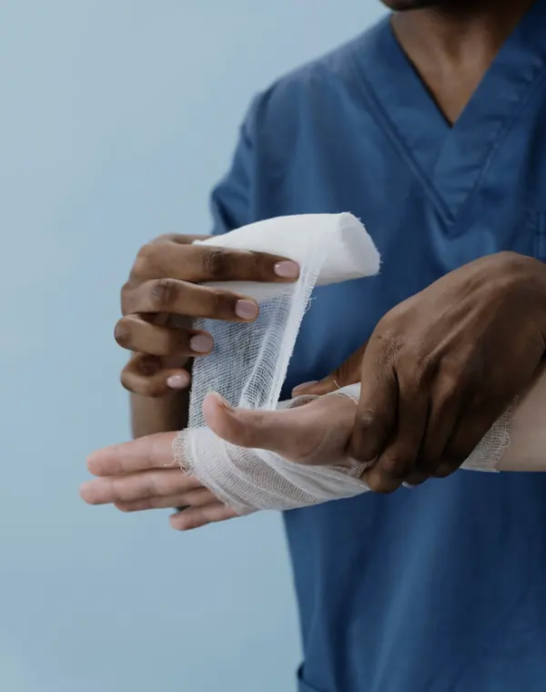 Medic wrapping an injured wrist