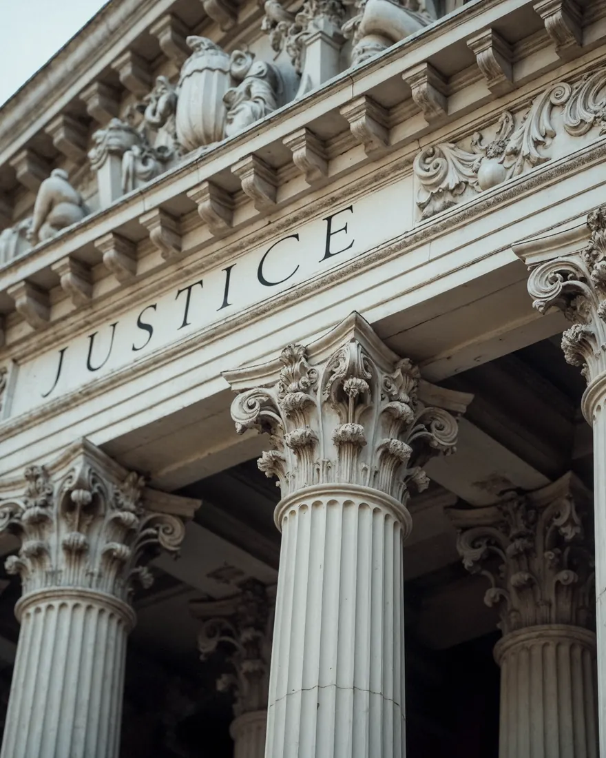 Courthouse columns with JUSTICE carved in the stone